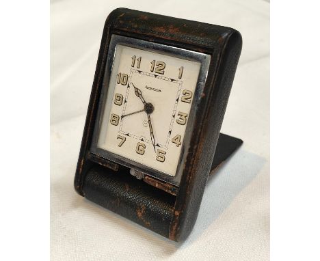 A Jaeger-Le Coultre 8 day travel alarm clock with chrome case, green leather exterior, Arabic numerals No 106670 