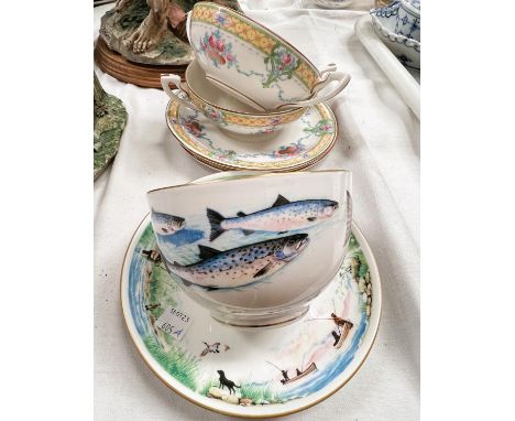 A Royal Worcester V.J.P fishing large breakfast cup and saucer, and a pair of Royal Worcester soup bowl and saucers 