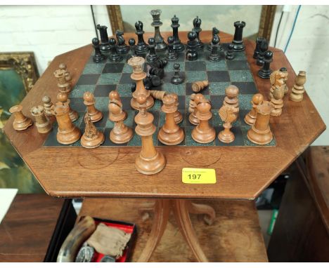 An antique part chess set in the Staunton style with some additional and replacement pieces, with chess table with stone inse