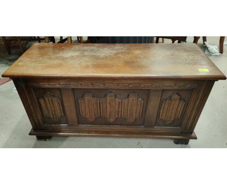 A small oak panel front chest with hinged lid, length 95cm 