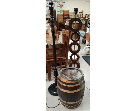 An unusual wooden standard lamp multiple stacked circles, a traditional lamp and a metal bound oak barrel, height 49cm 