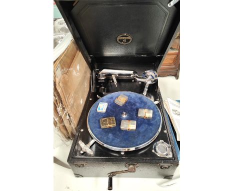 A Columbia portable wind-up gramophone and 78rpm records and spare needles 