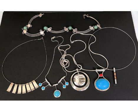 A selection of modern silver jewellery including a pendant set with large oval turquoise coloured stone on reticulated chain,