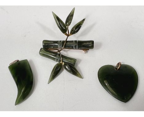 A Chinese Nephrite jade brooch in the form of bamboo with heart and claw matching pendants