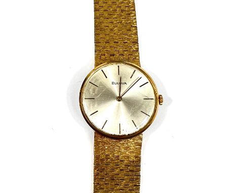 BULOVA: a c.1970's Bulova manual dress wristwatch with ivory dial, gold hands and baton markers, bark effect strap, (some min