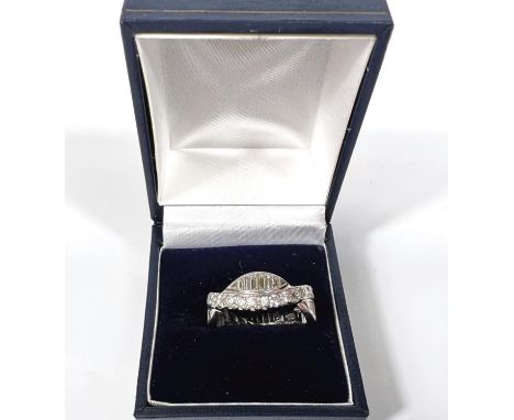 A white metal full eternity ring with 2 intertwined bands of round diamonds band of graduating baguette diamonds, size Q, 8.9