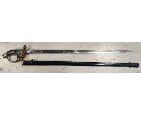 A 19th century Prussian offices sabre with curved hilt eagle to brass basket with scabbard