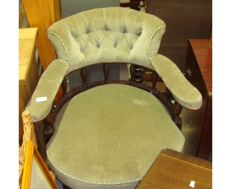 Early 20th century button back upholstered captains style chair