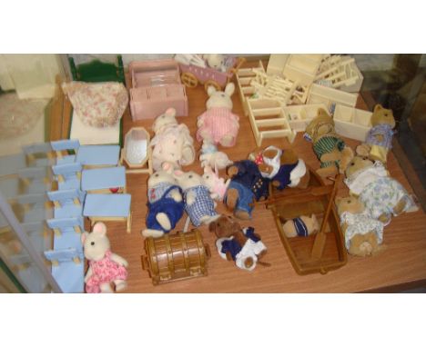 Shelf of Sylvanian Families furniture and families