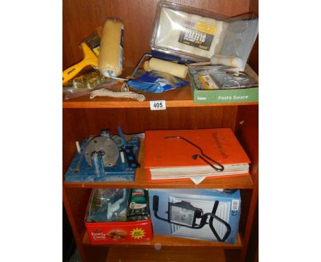 Three shelves of decorating and other tools. 