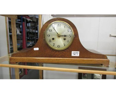 An oak eight day mantel clock. 