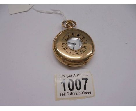A gold plated half hunter pocket watch.