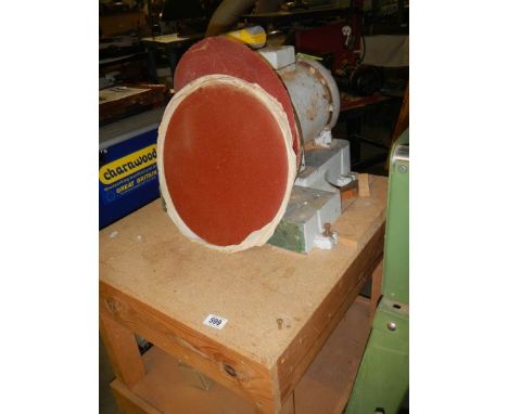A bench sander with disc. 