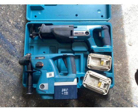 A Makita 24V hammer drill and resiprocated saw and 3 batteries (which don't hold much charge).&nbsp;50cm x 38cm x 12cm. appro