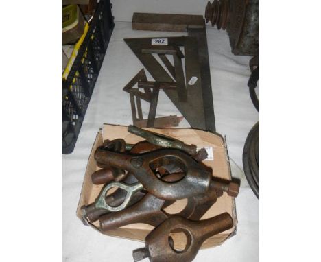 A collection of set squares. A set of lathe work turning tools. 