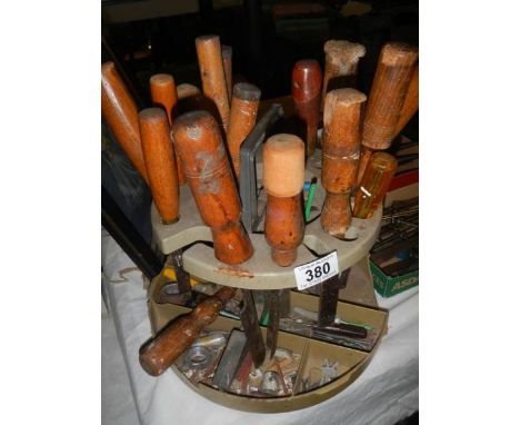 A circular tool stand with tools. 