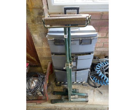 A pair of adjustable roller supports.