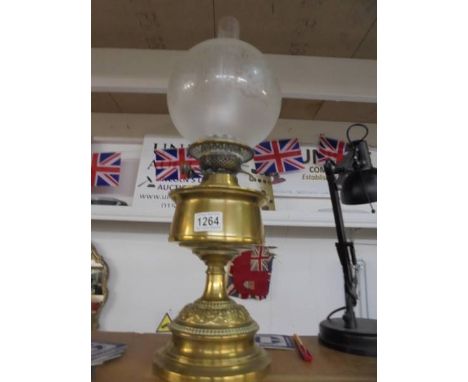 A brass oil lamp complete with chimney and acid etched shade, COLLECT ONLY. 