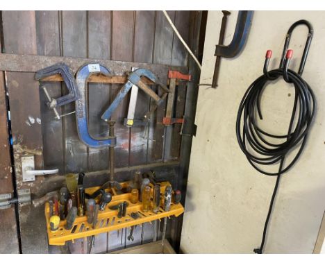 A collection of G cramps and a tray of various tools.