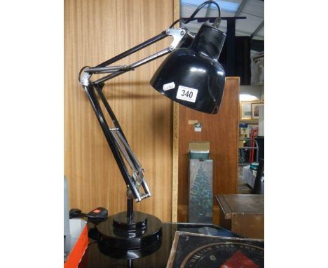 An industrial workbench with adjustable lamp. 
