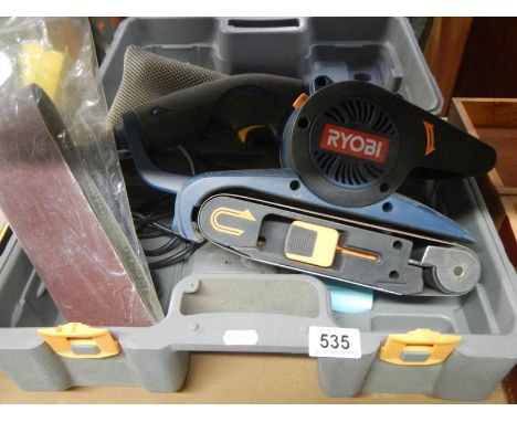 A Ryobi belt sander. 