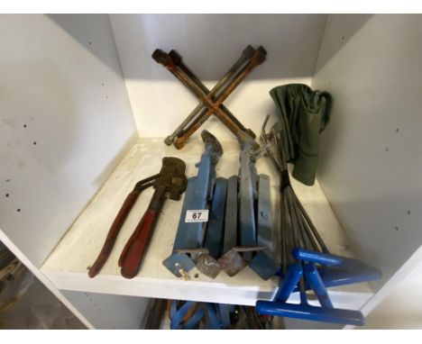 A pair of axle stands, 2 wrenches, a bundle of dent removal tools and 3 spider wrenches.