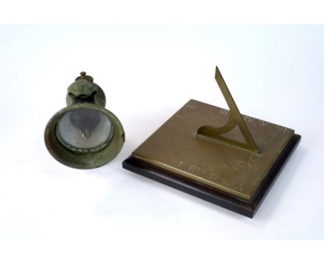An early 20th century bronze sun dial, the squared plate with incised Roman numerals, on a squared slate plinth base, 20 x 20