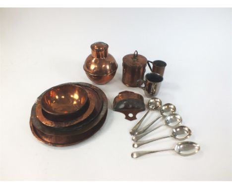 A collection of copper wares including an Art Nouveau tobacco jar and cover, a 'Channel Islands' caddy and cover, a bird feed