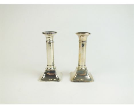 A pair of short silver mounted octagonal candlesticks, T Wilkinson &amp; Sons, Birmingham 1924, each 13cm high (loaded) (2)