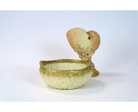 A Royal Worcester blush ivory nautilus shell vase, shape 494, 21cm high and a Royal Worcester blush ivory twin-handled basket