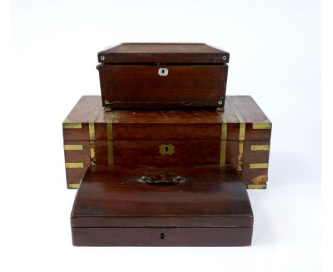 An early Victorian travelling writing slope of short domed form, with fitted interior and looping brass carrying handle, 35cm