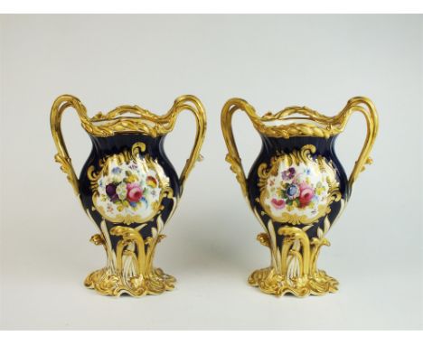 A pair of Staffordshire porcelain cobalt vases mid-late 19th century, of twin handled form with central panel painted with fl
