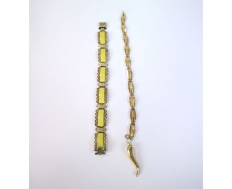 A yellow metal bracelet with attached charm, stamped '9ct', weight approx 8.4g, together with a yellow guilloche enamel white