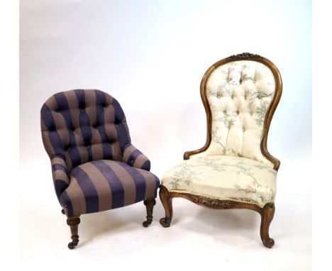 A small low Victorian upholstered button-backed nursing chair, covered in a striped mauve material on turned legs, 77 cm high