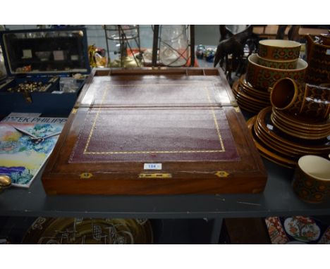 A Victorian brass bound mahogany writing slope with fitted interior and glass ink well.  Condition: missing key and inkwell. 