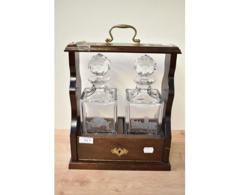 A quality 20th century mahogany two-bottle Tantalus with etching 'Underlay Garden School' and 'Underlay Hall School' to the f