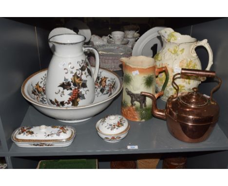 A large Majolica style pottery pitcher, decorated with elephant landscape scene, h23cm, sold together with a brass tea pot, c