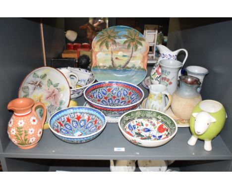 A large group of ceramic plates and jugs, to include a sheep planter, a Bourton stoneware jug, a Scottish stoneware vase, izn
