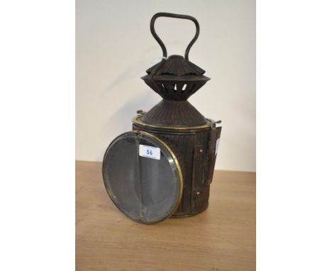 An antique railway aspect hand signal lantern having corrugated body, fitted inside with red and blue coloured glass, h31cmTh