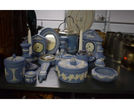 A group of Wedgwood Jasperware, decorated in blue and white sprigged with carved classical motifs, to include a barometer, ca