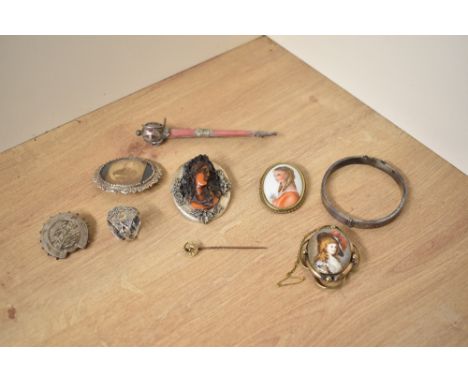 A large silver mounted cameo brooch depicting a prominent maiden in profile, along with a silver hinged bangle, silver Mizpah