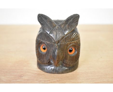 An early 20th century black forest style carved wooden owl inkwell, having glass eye's, h8cm