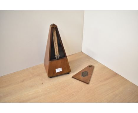 A vintage Maelzel Metronome, bearing the plaque Maelzel Paquet 1815 - 1846 Made in France, appears to be in working order, H2
