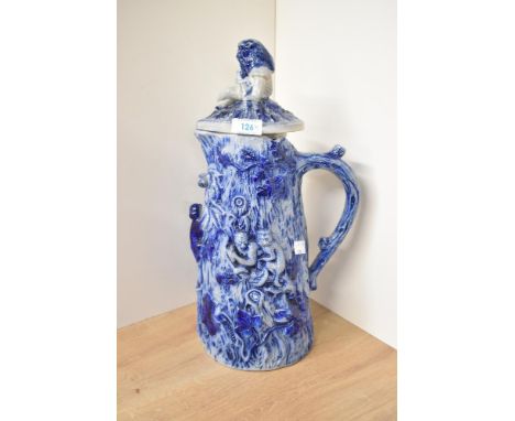 A large German Rhenish Pottery salt glazed pitcher modelled with monkeys holding acorns and climbing a tree, h40cm.  Conditio
