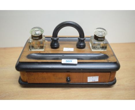 A 19th century rosewood desk caddy fitted having glass inkwell and pen tray, w25cm
