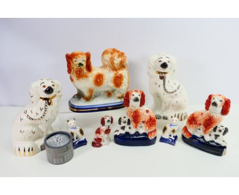 Lot to include a pair of Beswick spaniels, 1378-4, further Staffordshire type figures and a small Swarovski puppy figure (box