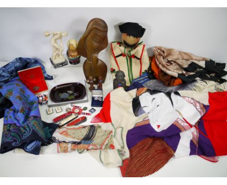 A mixed lot comprising scarves to include silk, Russian matryoshka dolls, pin badges, hand puppet, penknives and other. [W]

