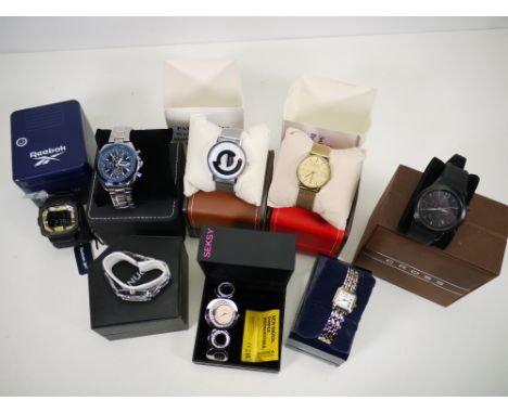 A collection of boxed fashion wristwatches to include Cross, Visioner Blue Angels, Seksy, Reebok, Sekonda and other. [W]