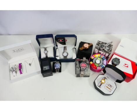 A good collection of boxed watches to include; A cased authentic Michael Kors (back stamped Michael Kors MK 5799 all stainles