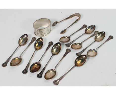 Hallmarked Silver - a set of 12 silver coffee spoons and a matched pair of sugar nips, Birmingham assay 1897, and a silver na